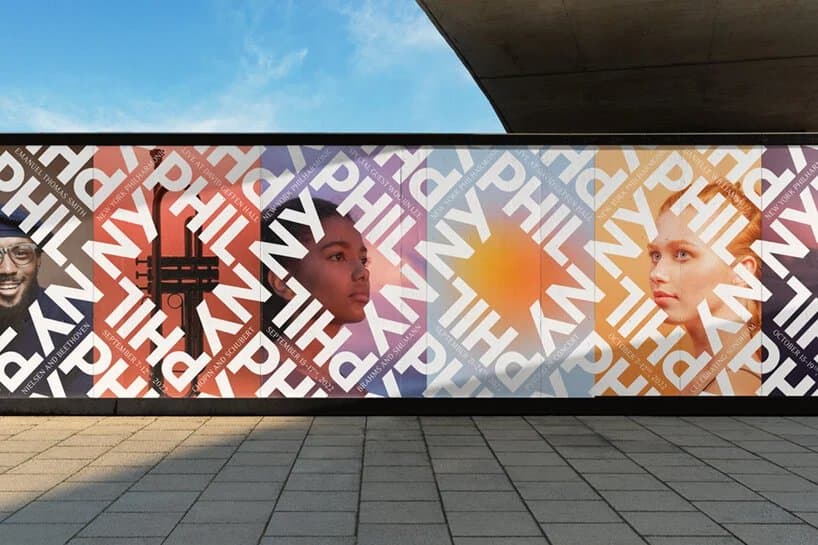 Bold typographic mural on a building wall with overlapping colorful letters and geometric patterns